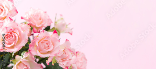 Bouquet beautiful flowers pink roses on pastel pink background table. Birthday, Wedding, Mother's Day, Valentine's day, Women's Day. Front view, banner