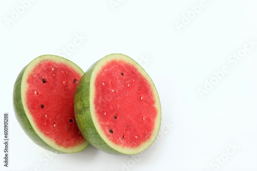 Watermelon cut into two parts, on a white background, red ripe, berry, healthy food, sweet, dessert, background, day, holiday, text, write, happiness, health, nutrition, background, wallpaper 