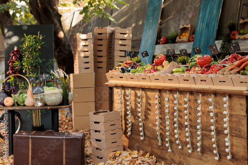 Empty farmers market stall full of fresh local organic food with wide variety of colorful organic fruits and vegetables. Seasonal products farm produce stand with healthy natural food.