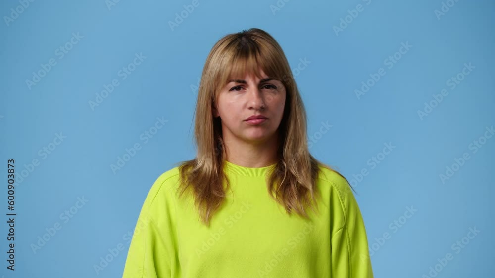 4k video of cute girl over blue background. 4k video of cute girl over blue background.