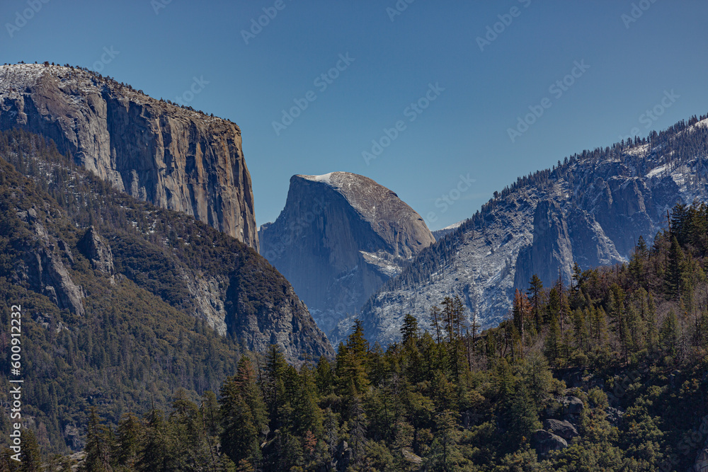 Yosemite NP, CA, USA - March 29, 2022: Majestic views of granite formations, waterfalls, lakes and streams located within this popular destination. Yosemite NP, CA, USA - March 29, 2022: Majestic views of granite formations, waterfalls, lakes and streams located within this popular destination.