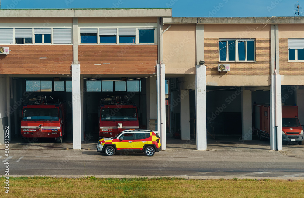 Fire station with fire trucks inside.