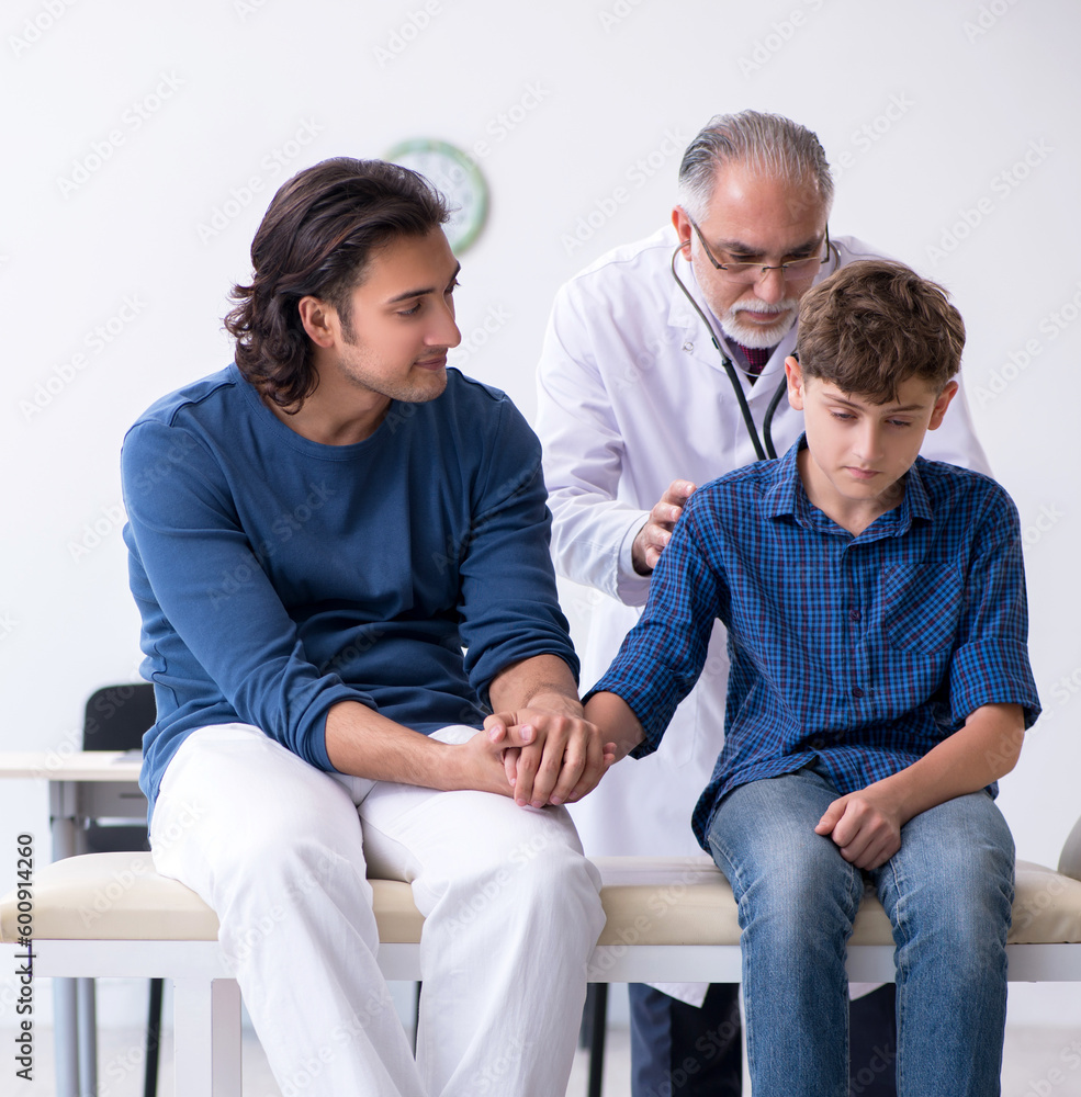 Fototapeta premium Young boy visiting doctor in hospital