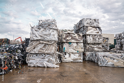 recycling plant scrap yard bales of aluminum and stainless steel  crane with claw