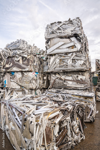 recycling plant scrap yard bales of aluminum and stainless steel crane with claw