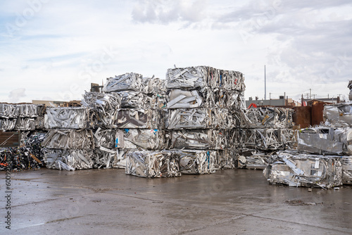recycling plant scrap yard bales of aluminum and stainless steel  crane with claw