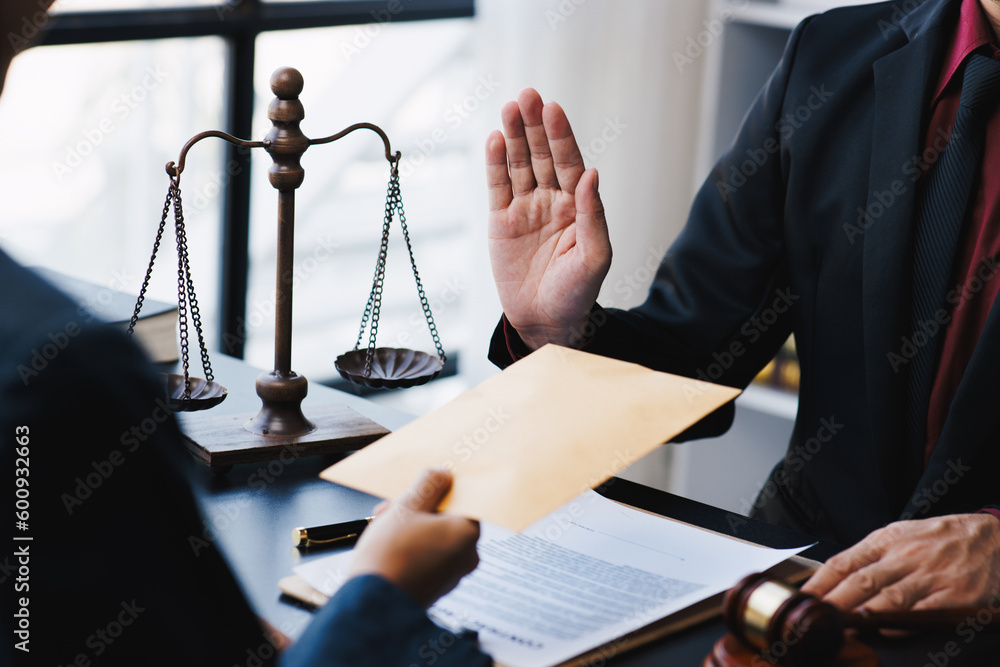 Lawyer refuse to accept bribes that are given in envelopes. To do