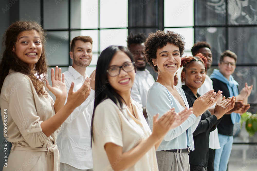 Obraz premium High angle view of multiethnic people cheering after a seminar
