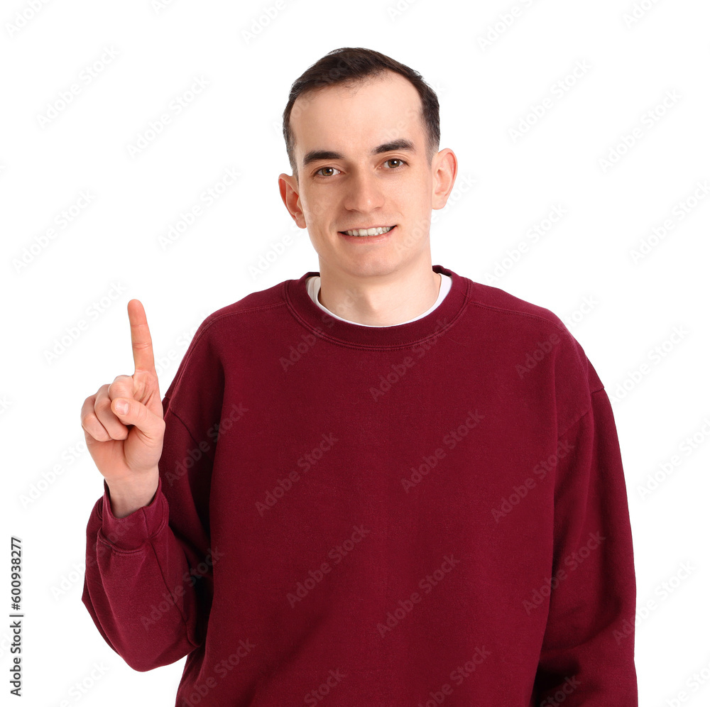 Young man showing one finger on white background Young man showing one finger on white background
