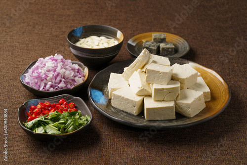 Ingredients required for fried stinky tofu on a monochrome background