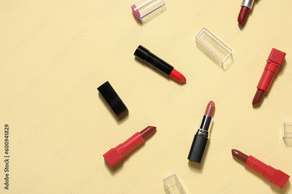 Different lipsticks on yellow background Different lipsticks on yellow background