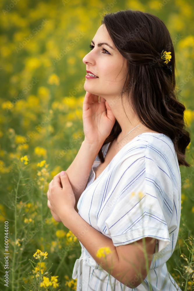 Young pretty woman looks at the sky with satisfaction