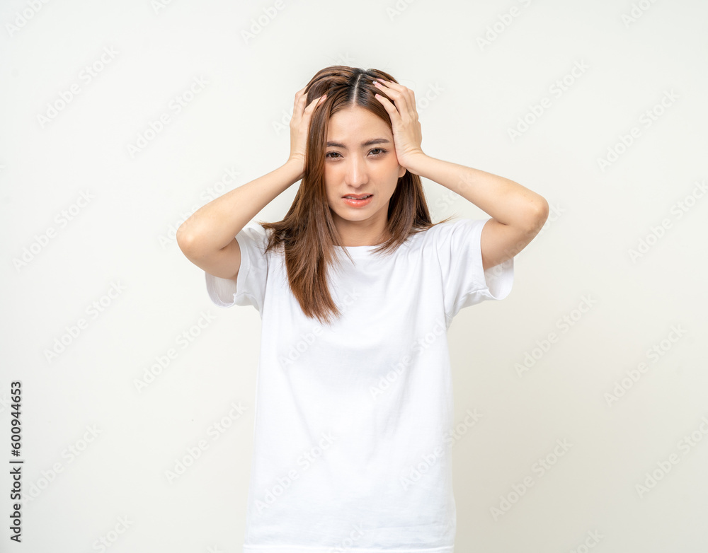 Young asian beautiful woman hand touching head she's feeling depressed stress headache be tired from working standing on isolated white background she has symptom office syndrome. Young asian beautiful woman hand touching head she's feeling depressed stress headache be tired from working standing on isolated white background she has symptom office syndrome.