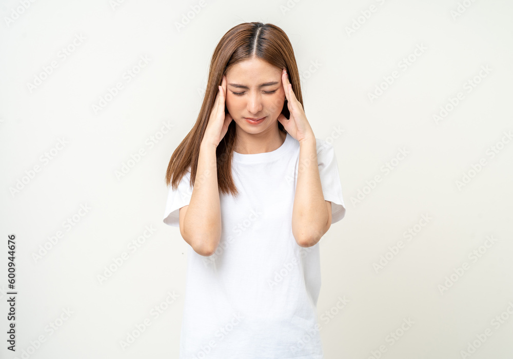 Young asian beautiful woman hand touching head she's feeling depressed stress headache be tired from working standing on isolated white background she has symptom office syndrome. Young asian beautiful woman hand touching head she's feeling depressed stress headache be tired from working standing on isolated white background she has symptom office syndrome.