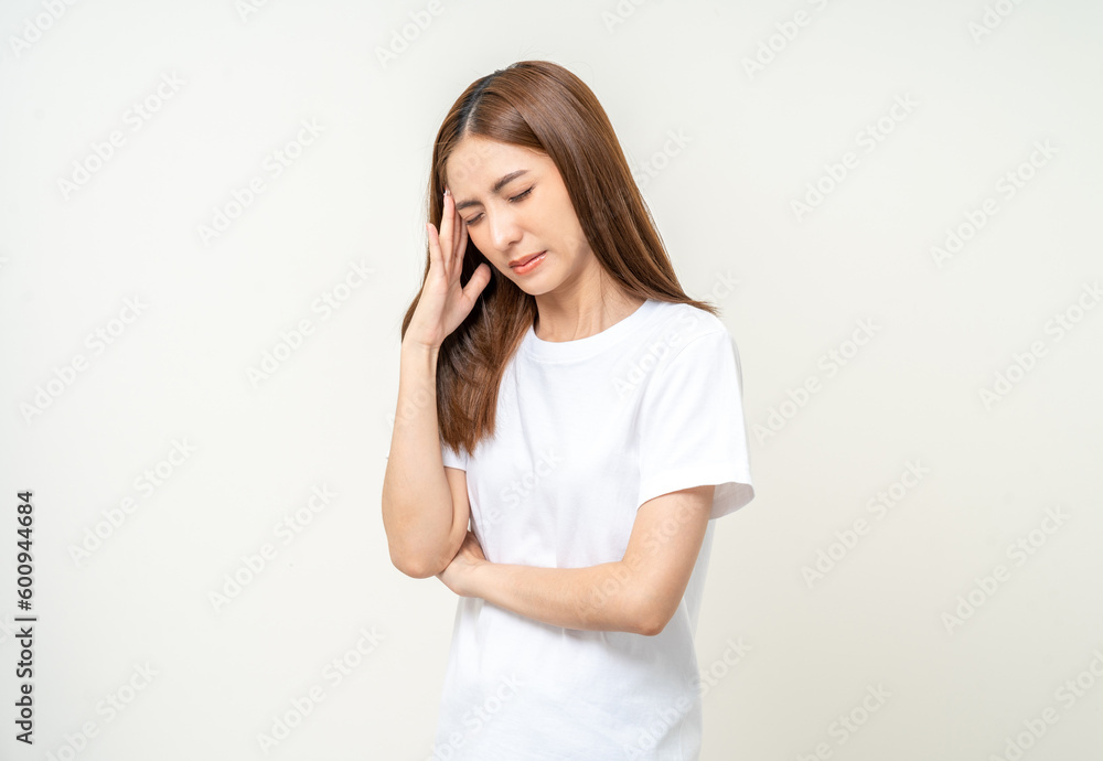 Young asian beautiful woman hand touching head she's feeling depressed stress headache be tired from working standing on isolated white background she has symptom office syndrome. Young asian beautiful woman hand touching head she's feeling depressed stress headache be tired from working standing on isolated white background she has symptom office syndrome.