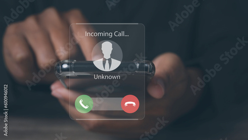 Vászonkép Man answering to incoming from an unknown caller