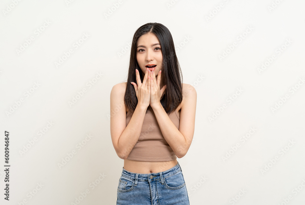 Excited young asian woman shout out loud wow hands on mouth announcement isolated white background. Emotional Happy shocked face female wow promotion advertising concept. Excited young asian woman shout out loud wow hands on mouth announcement isolated white background. Emotional Happy shocked face female wow promotion advertising concept.