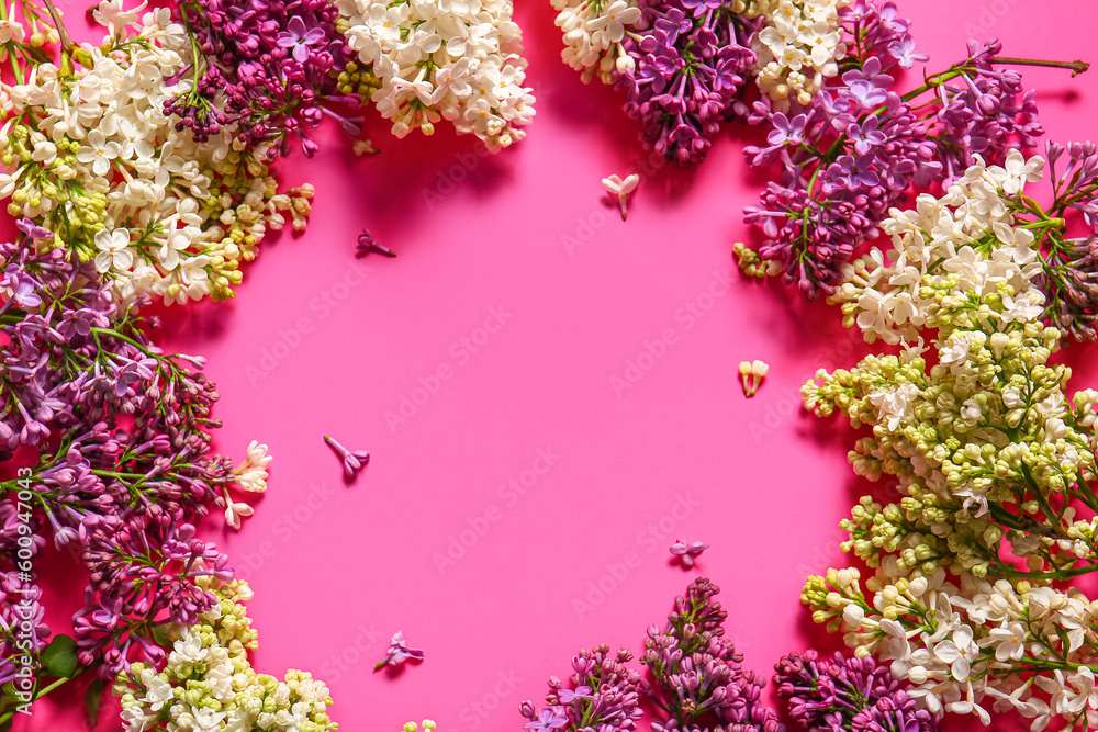Frame made of blooming lilac flowers on pink background Frame made of blooming lilac flowers on pink background
