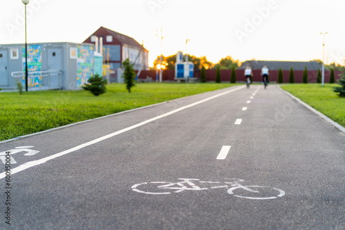 people in a blur on a bike path