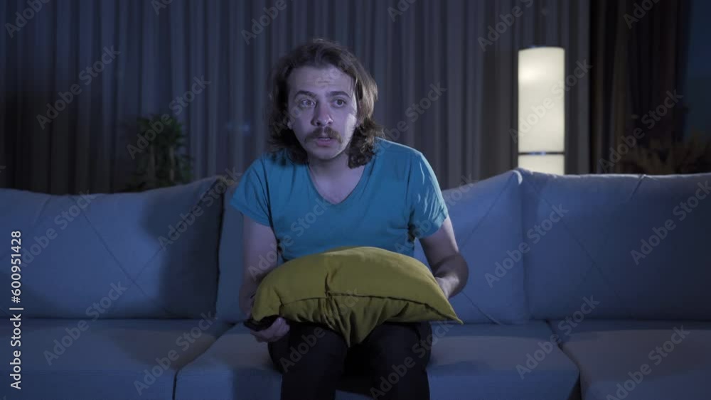 The man who watches horror and thriller movies or documentaries at night gets scared. The man who watches horror and thriller movies or documentaries at night gets scared.