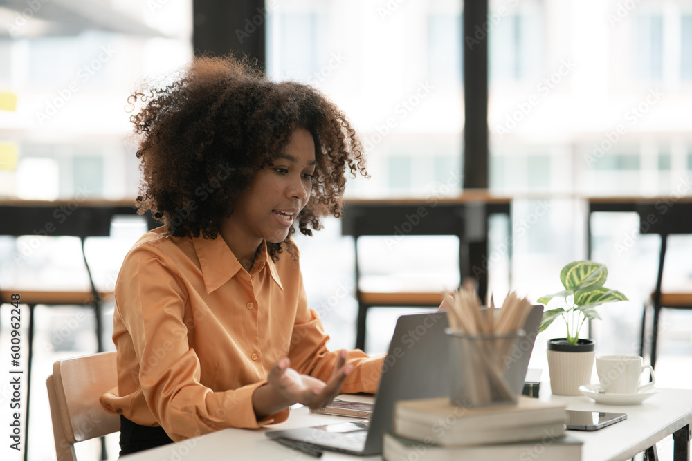 Asian businesswoman holding notebook about business, spending money Asian businesswoman holding notebook about business, spending money