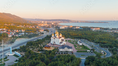 Gelendzhik, Russia. Cathedral of St. Andrew the First Called. The text at the entrance to the city is translated as Gelenzhik-City Resort. Sunset time, Aerial View