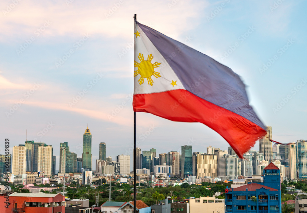 National flag of the Philippines flapping in the wind,with a backdrop ...