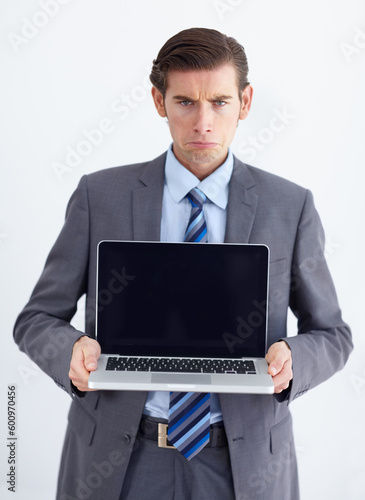 Blank screen, laptop and portrait of a upset business man with 404 and internet problem. Isolated, white background and studio with a male businessman with computer issue and technology error