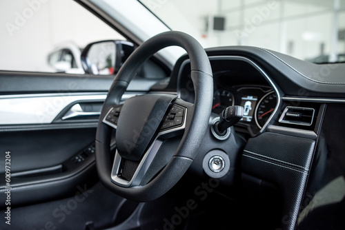 New modern car interior inside in modern showroom © RomanR