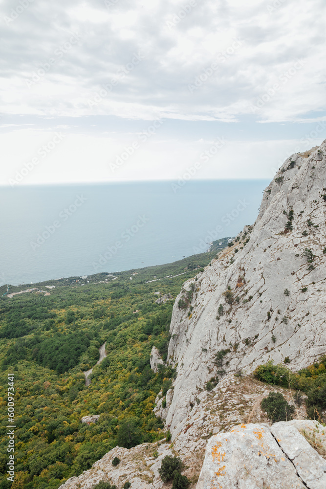 Naklejka premium big mountains with green forest and sea nature hiking journey