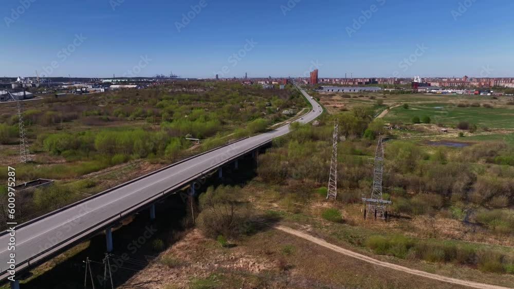 Aerial view of the road used by transport and trucks driving to and from the city.