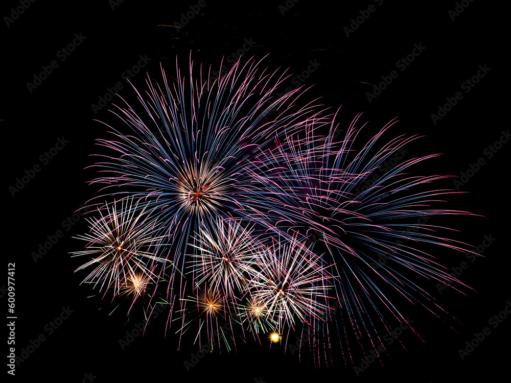 Multiple fireworks against the deep black sky. Bright display of the fireworks Multiple fireworks against the deep black sky. Bright display of the fireworks