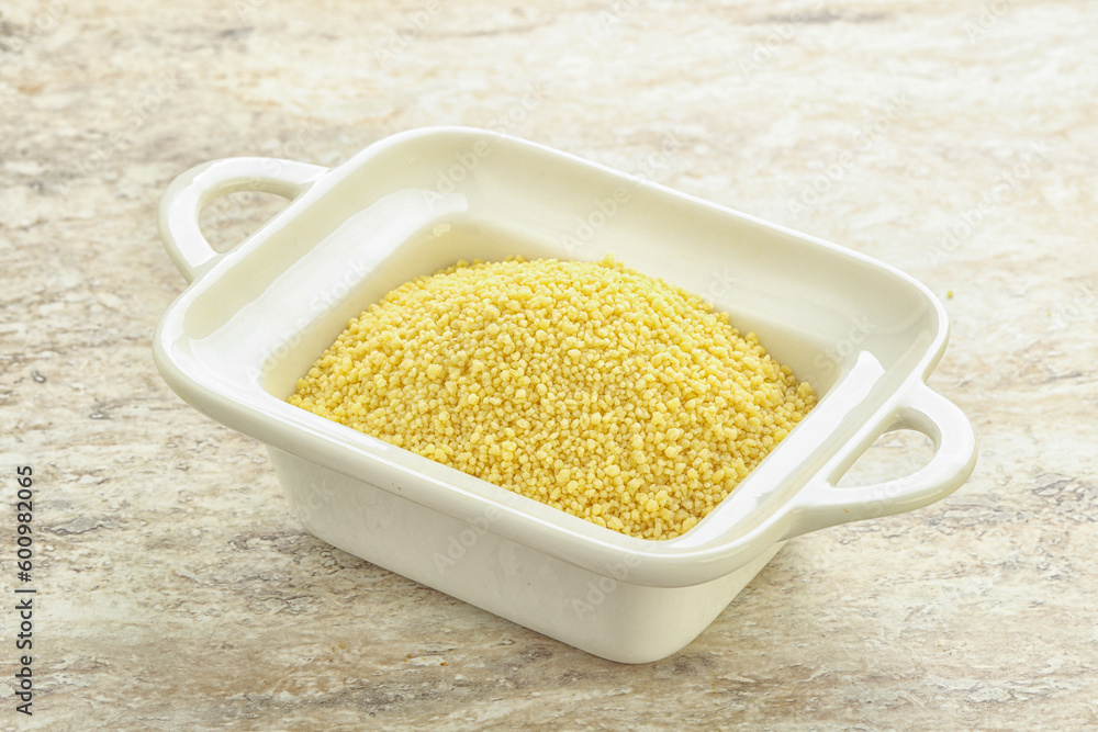 Raw couscous in the bowl Raw couscous in the bowl
