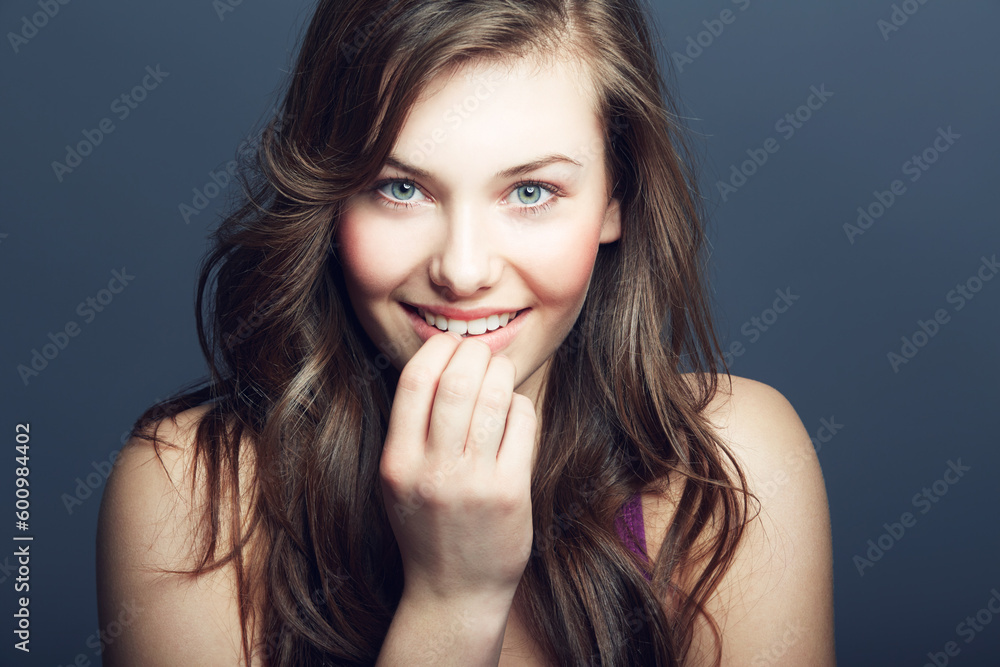 Beauty, face and skin portrait of a woman in studio with a smile, makeup and cosmetics. Headshot of a happy gen z female model on a grey background for natural glow, hair care and dermatology Beauty, face and skin portrait of a woman in studio with a smile, makeup and cosmetics. Headshot of a happy gen z female model on a grey background for natural glow, hair care and dermatology