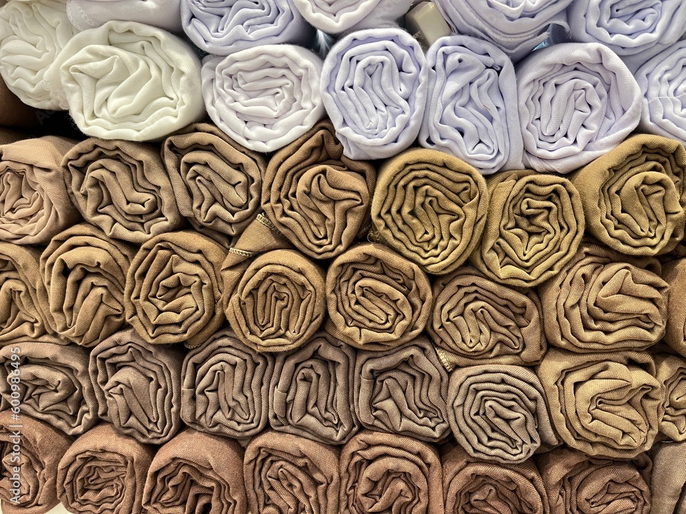 Colorful pile of hijab roll in a hijab store for fashion and styling Muslim woman