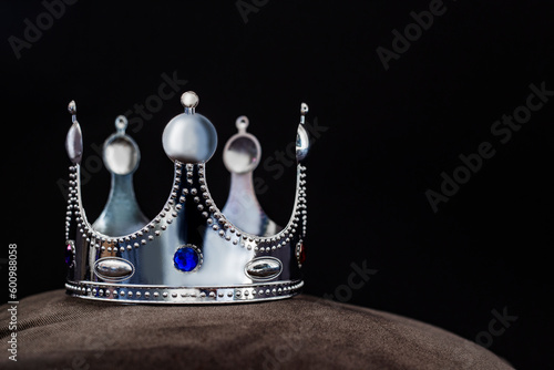 silver crown isolated on black background, winner success concept