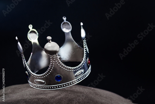 silver crown isolated on black background, winner success concept