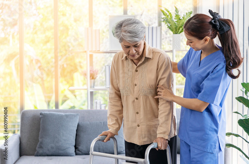 Retirement woman being cared for by an attractive nurse.