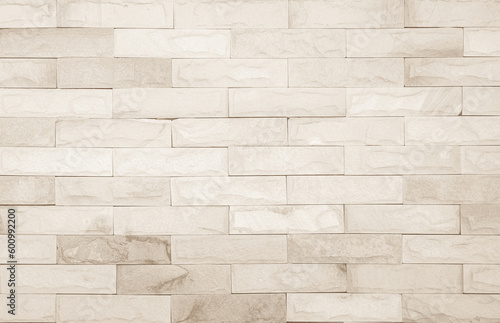 Obraz na plátně Empty background of wide cream brick wall texture