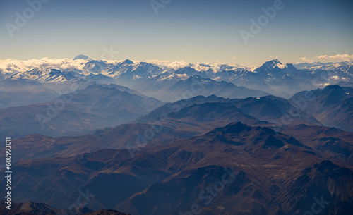 Fototapeta Naklejka Na Ścianę i Meble -  Andes Mountains from above. Aerial view with the amazing landscape of Andes next to Santiago Chile.