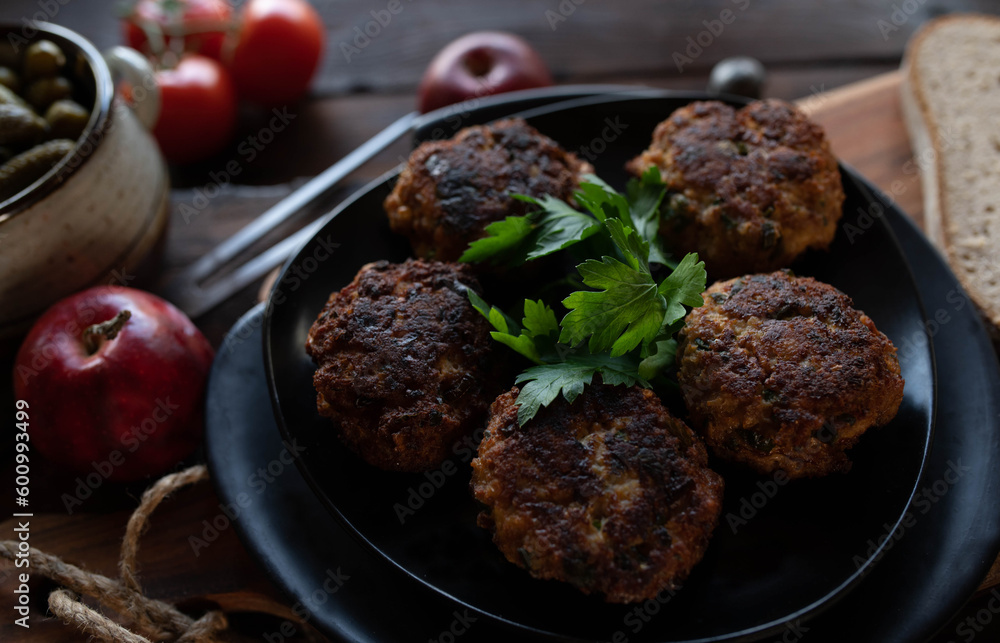 Frikadeller, traditional pork meatballs with bread and pickles Frikadeller, traditional pork meatballs with bread and pickles