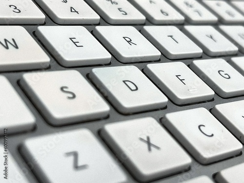 close up of apple magic keyboard with tilt shift black and white and imperfections © william