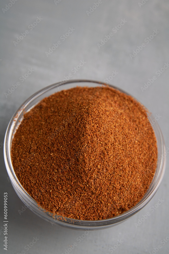 photo paprika poured in a glass deep dish