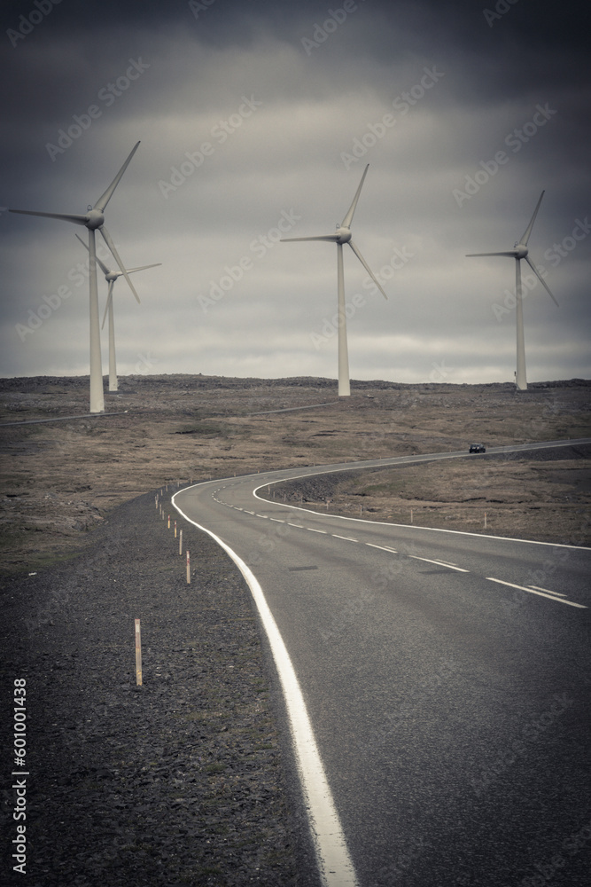 desolate road and wind turbines