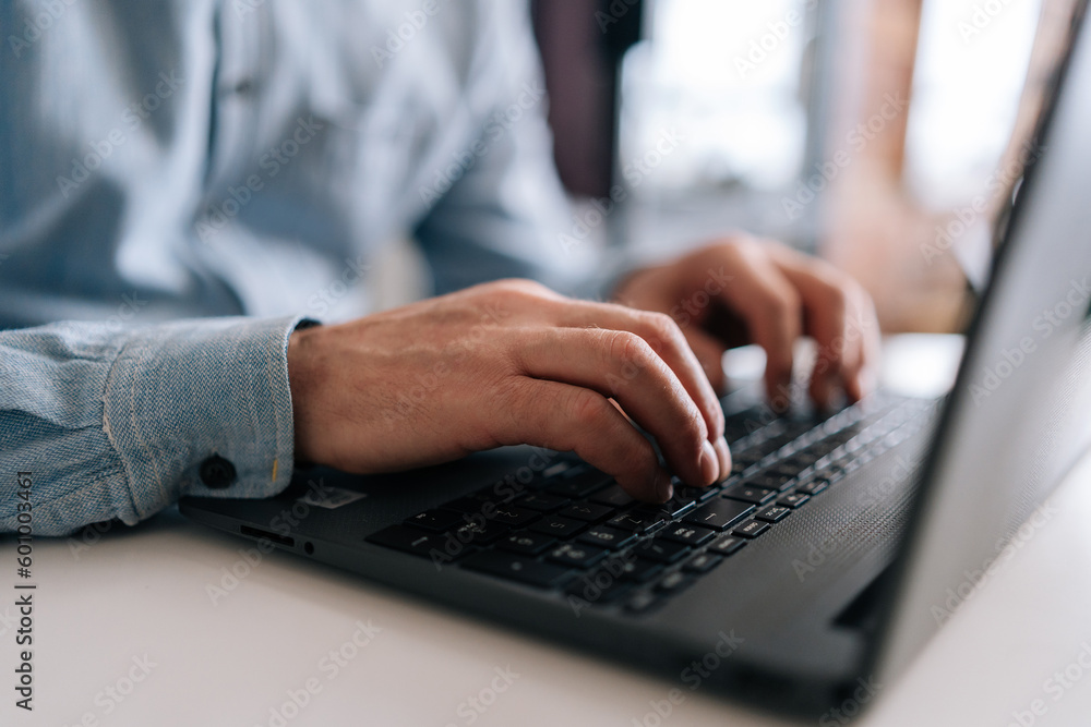 Close-up wrinkly hands of unrecognizable senior older businessman typing on laptop keyboard. Closeup cropped shot of elderly man entrepreneur in home workplace using portable computer sitting at desk. Close-up wrinkly hands of unrecognizable senior older businessman typing on laptop keyboard. Closeup cropped shot of elderly man entrepreneur in home workplace using portable computer sitting at desk.