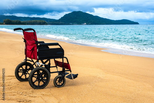 Empty wheelchair parking on sand beach, Handicap Vacation concept