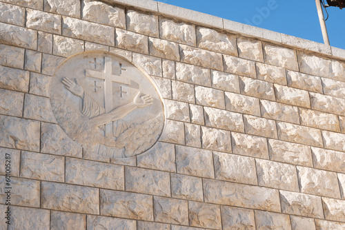 Nazareth, Israel - August 16, 2021: Franciscan coat of arms on the side of the Church of the Annunciation in Nazareth photo