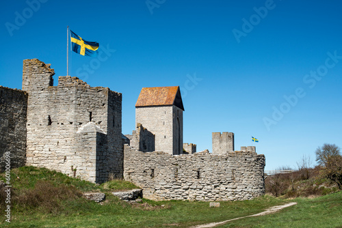 Visby medieval wall and old town in Gotland, Sweden with the Swedish flag