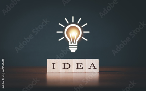 light bulb icon with wooden blocks write IDEA. Start for new idea and creativity concept.