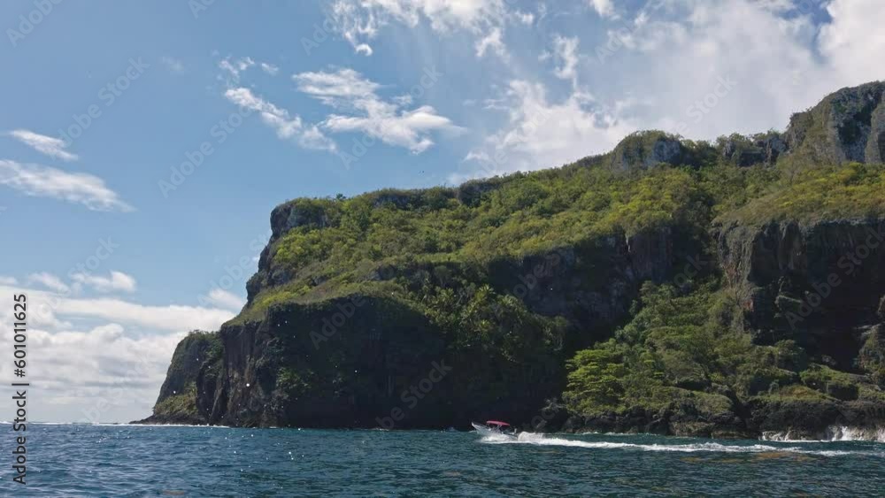 View from tourist boat of Las Galeras headland promontory and cliffs in Dominican Republic. Handheld sideways View from tourist boat of Las Galeras headland promontory and cliffs in Dominican Republic. Handheld sideways